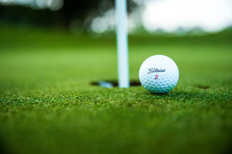 Close-up photo of a golf ball on the tee